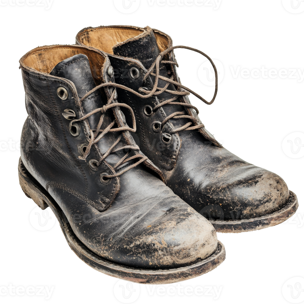 Worn black boots with mud, showcasing signs of use, cut out transparent png