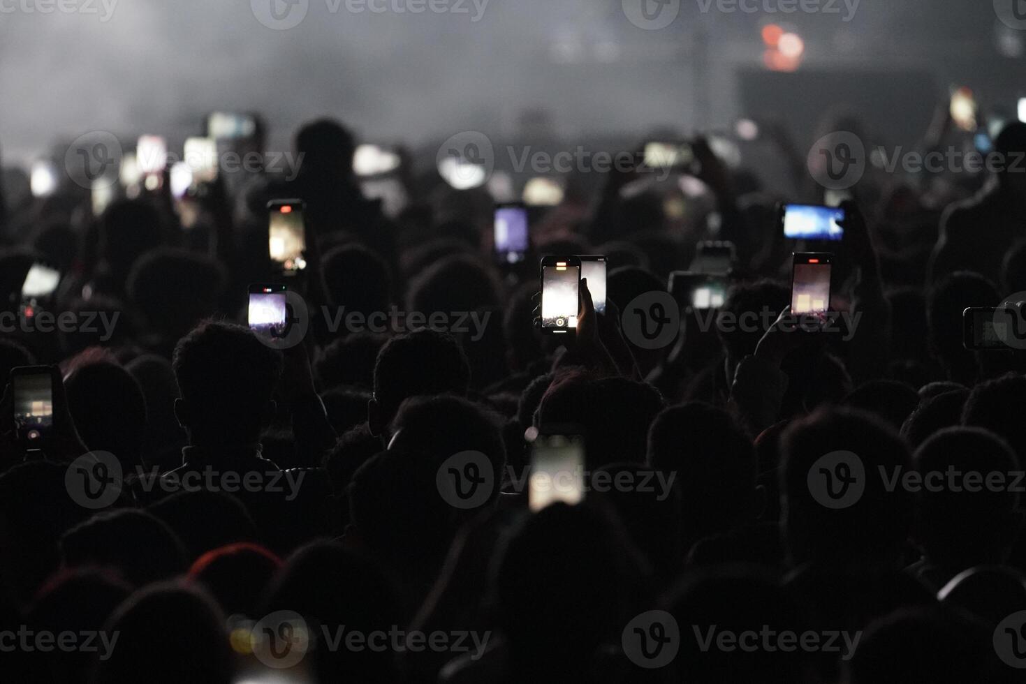 People are watching a concert photo