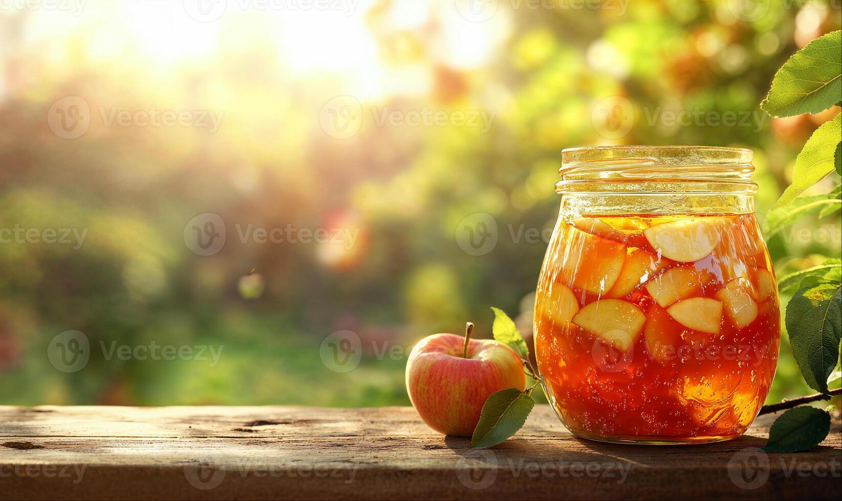 Apple jam in jar, fruit orchard background with copy space photo