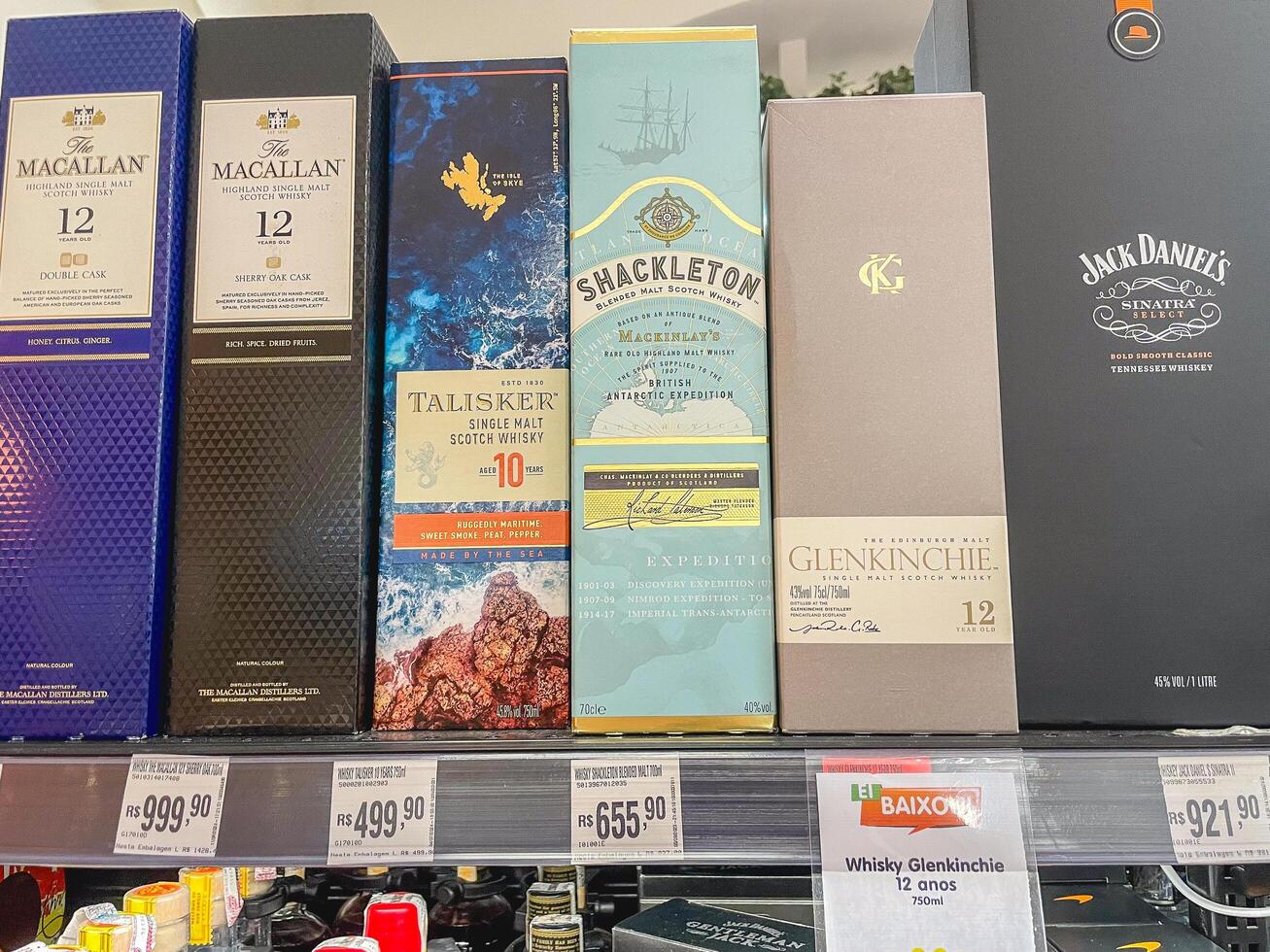 Sao Paulo, Brazil August 17, 2024. Different kind of whiskeys on the shelves with a price tag, in a supermarket in Sao Paulo, Brazil photo