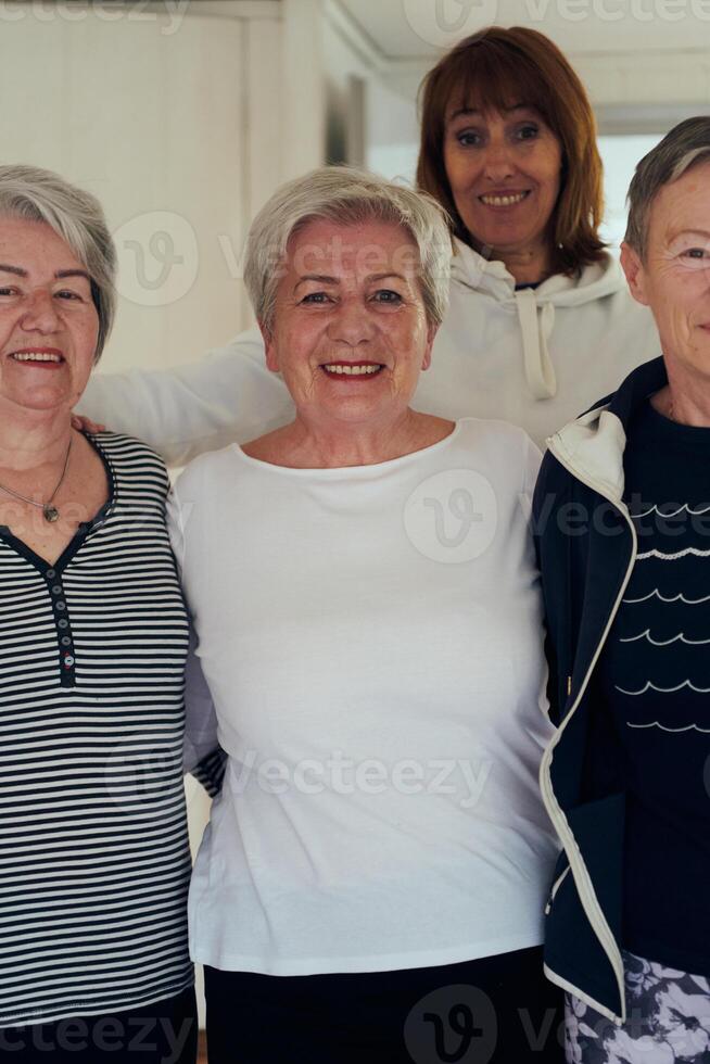 A vibrant community of senior women, guided by their instructor, embraces the enriching journey of yoga, fostering unity, well-being, and a shared commitment to active aging photo