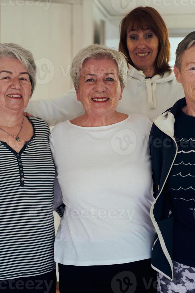 A vibrant community of senior women, guided by their instructor, embraces the enriching journey of yoga, fostering unity, well-being, and a shared commitment to active aging photo