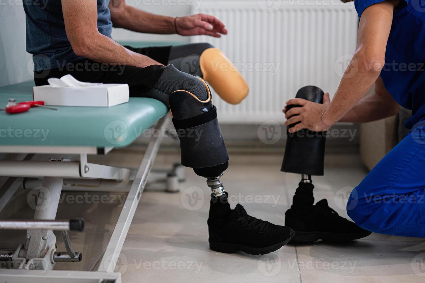 Prosthetic fitting and adjustment in rehabilitation clinic photo