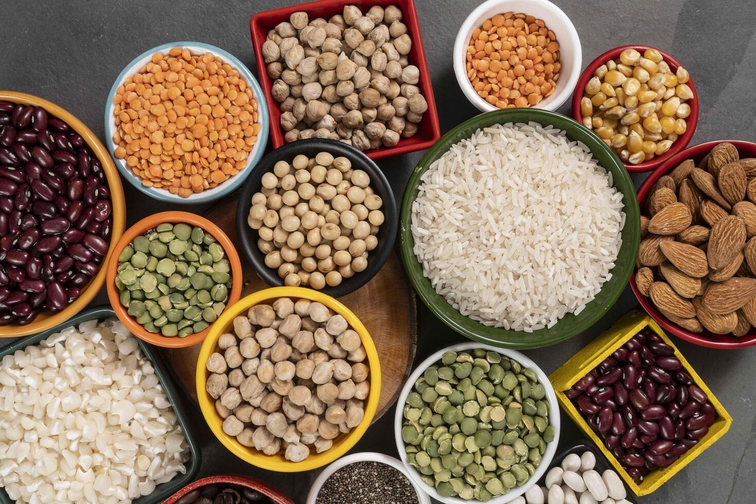 several pots with raw grains for preparing healthy food photo