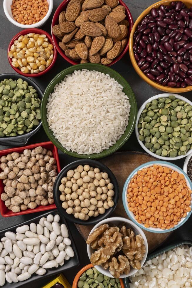 several pots with raw grains for preparing healthy food photo