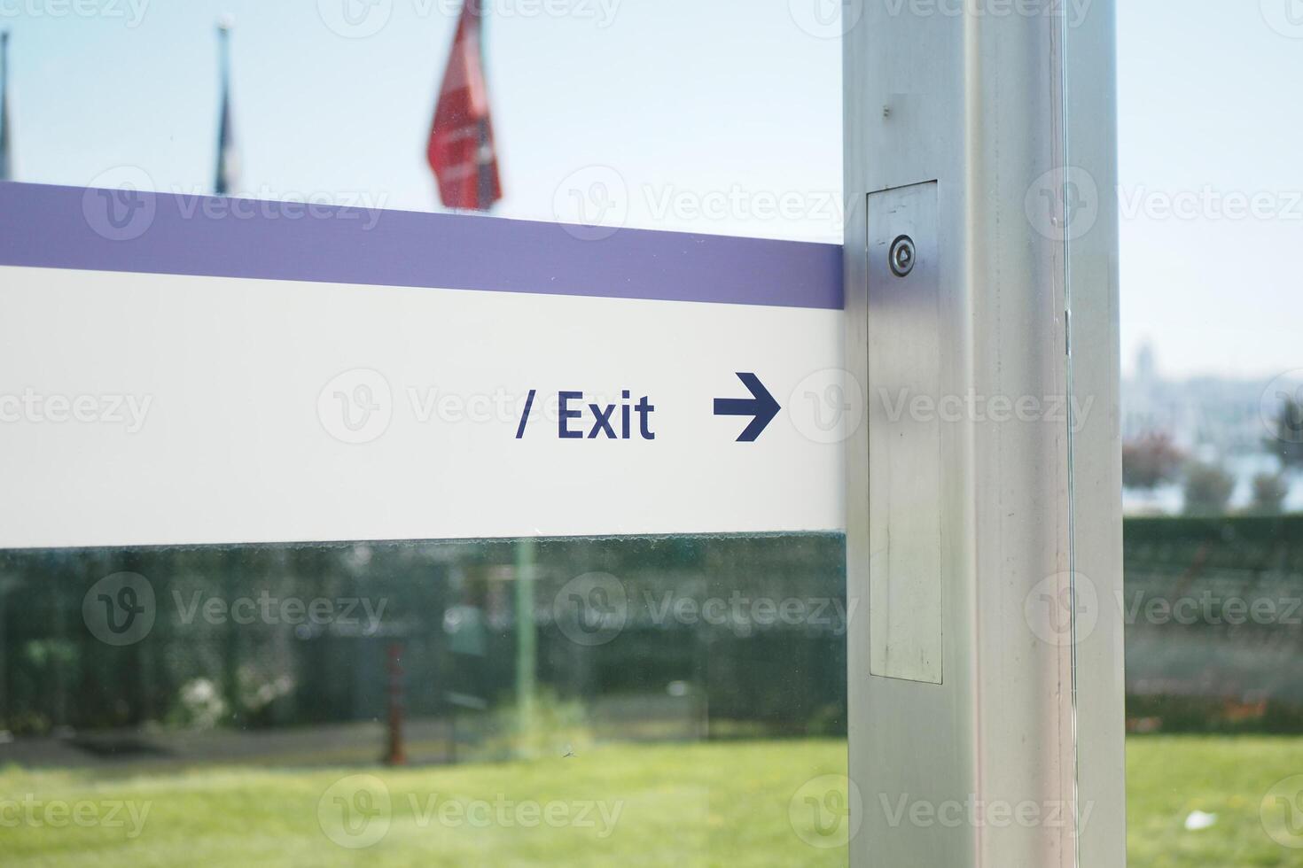 Signage Clearly Indicating the Exit Direction at a Specific Urban Location for Navigation and Safety photo
