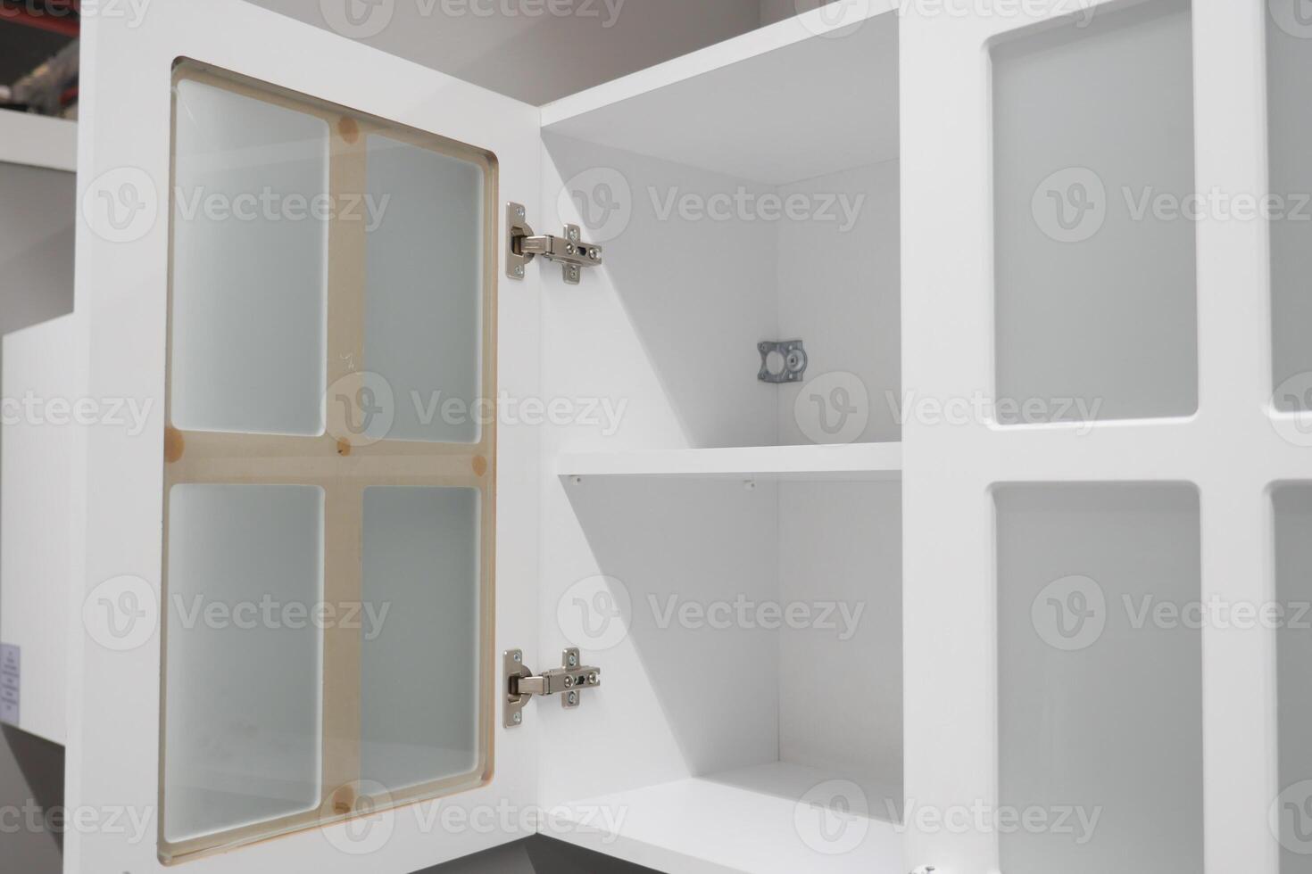 Contemporary and Sleek Modern White Kitchen Cabinet Featuring Stylish Glass Doors for Elegance photo