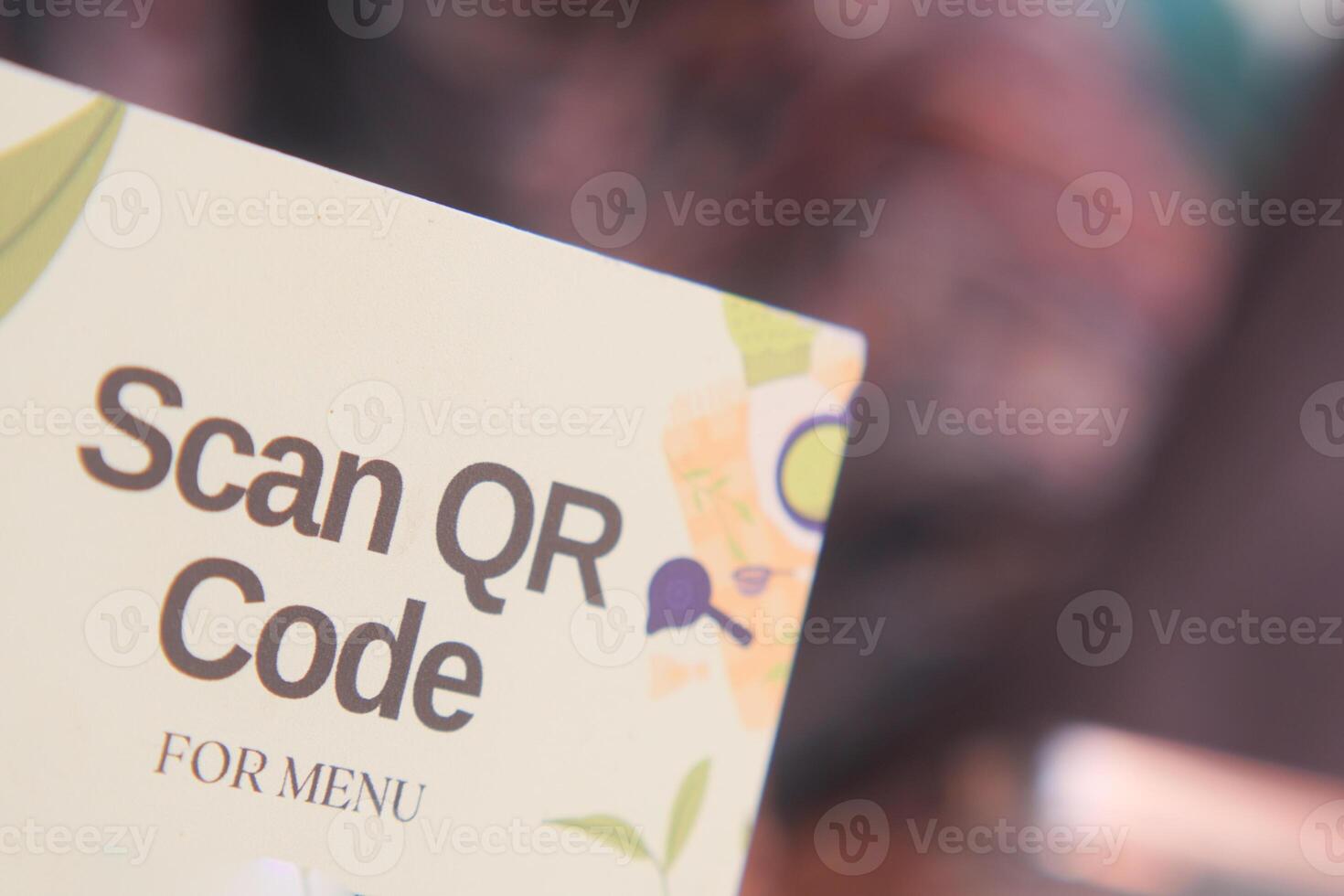 woman hand using the smart phone to scan the qr code to select food menu in the restaurant photo