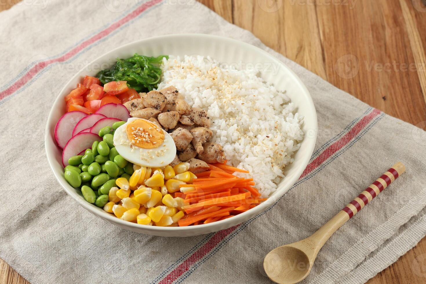 Hawaiian Ahi Chicken Poke Bowl Salad with Edamame, Corn, Tomato, Carrot, and Steamed Egg photo