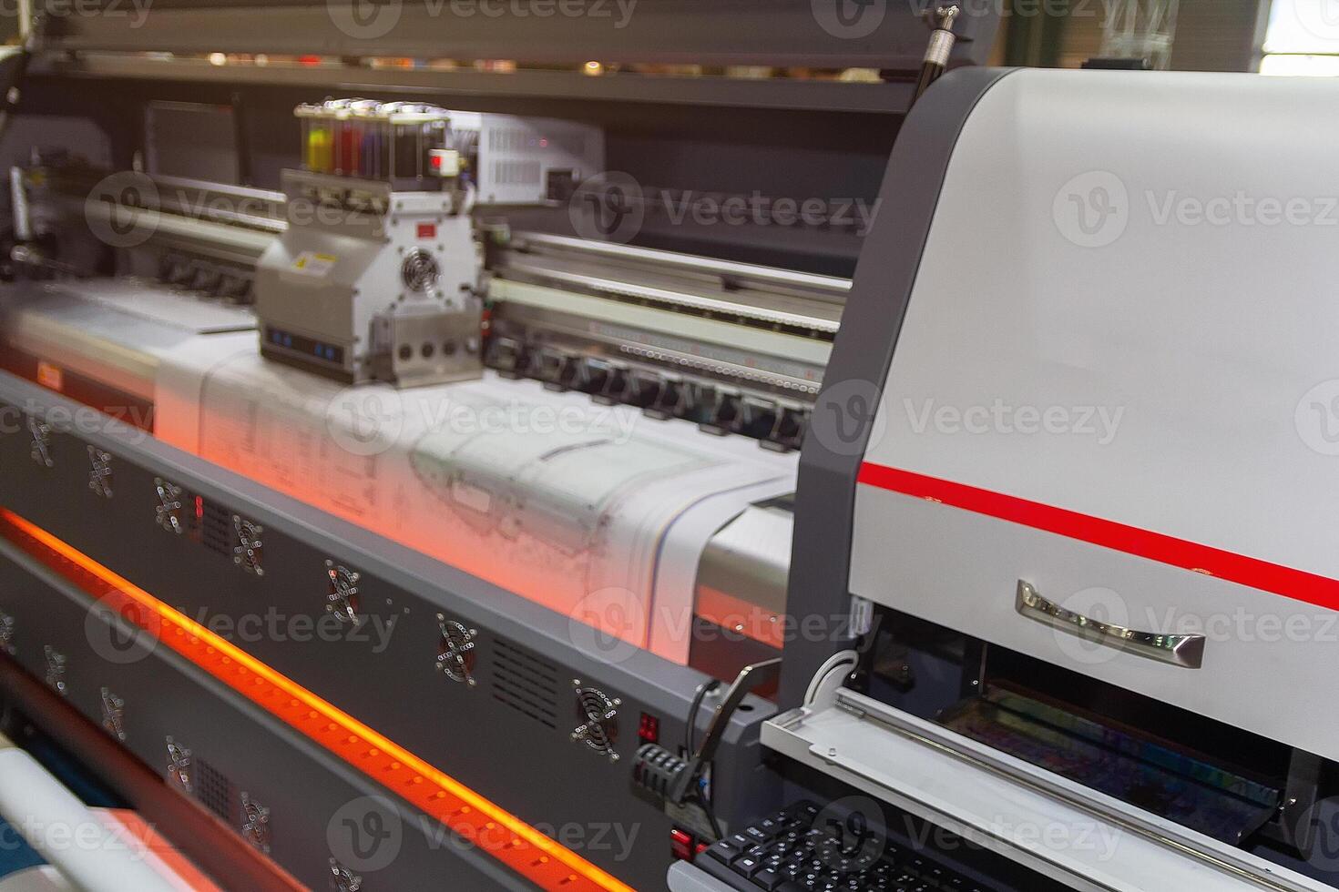 Large format printing machine in operation. photo