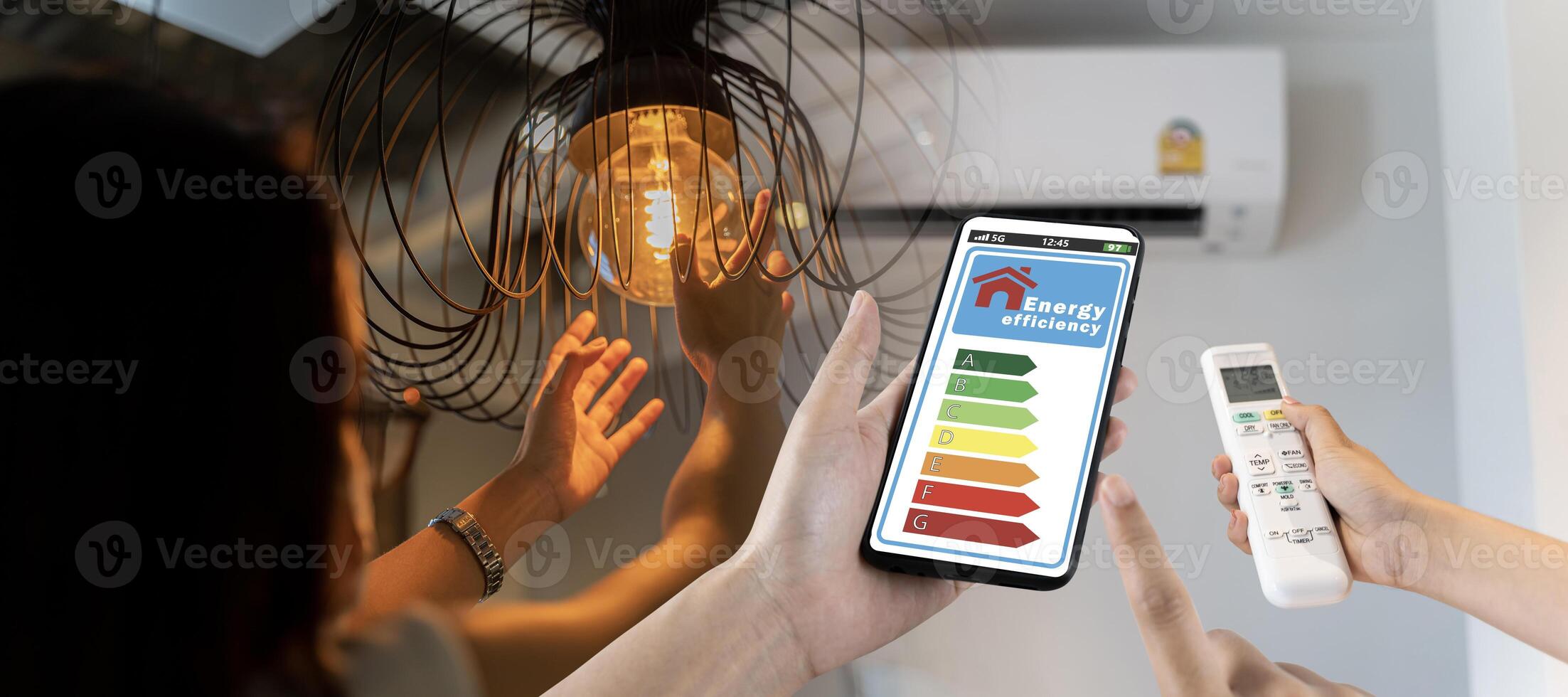 Home appliance energy efficient. Household equipment and energy class chart. Power saving concept. Woman change a new electric bulb, open air conditioning 25 degrees photo