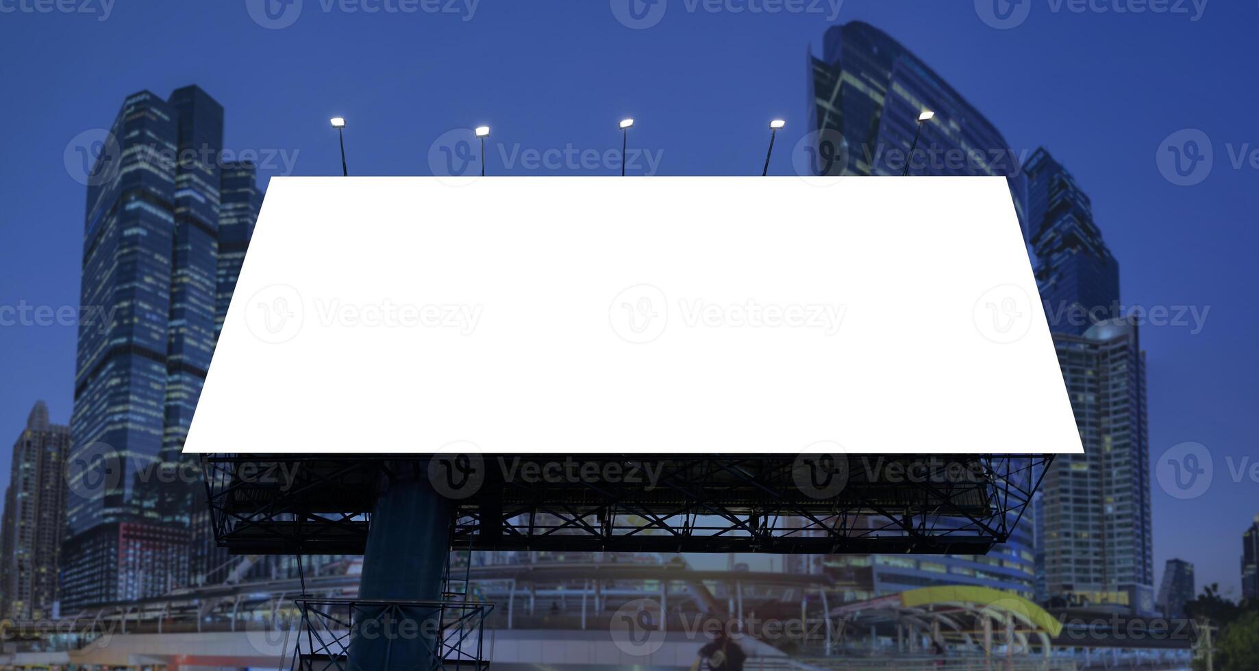 Empty billboard for advertising in the city of Bangkok at sunrise. Large outdoor billboards in the downtown area Blank white signboard on the background photo