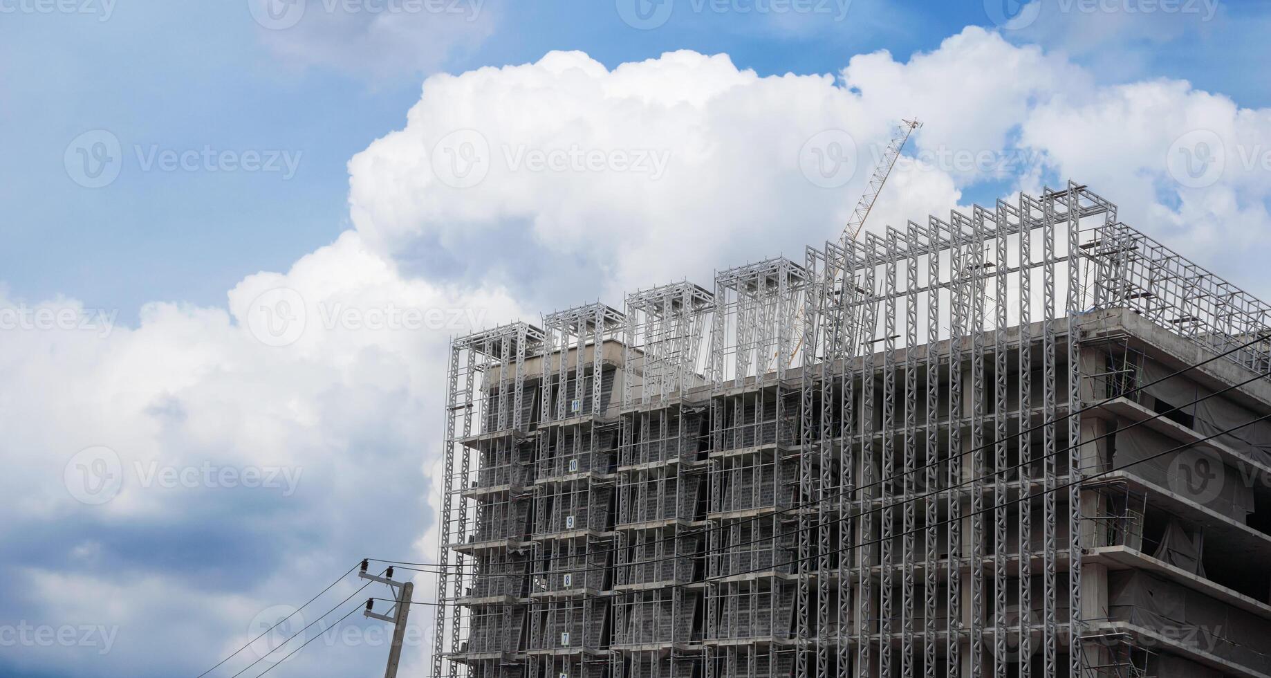 Panoramic view where workers are working on a big construction site and many cranes are working in, new building business industry. photo