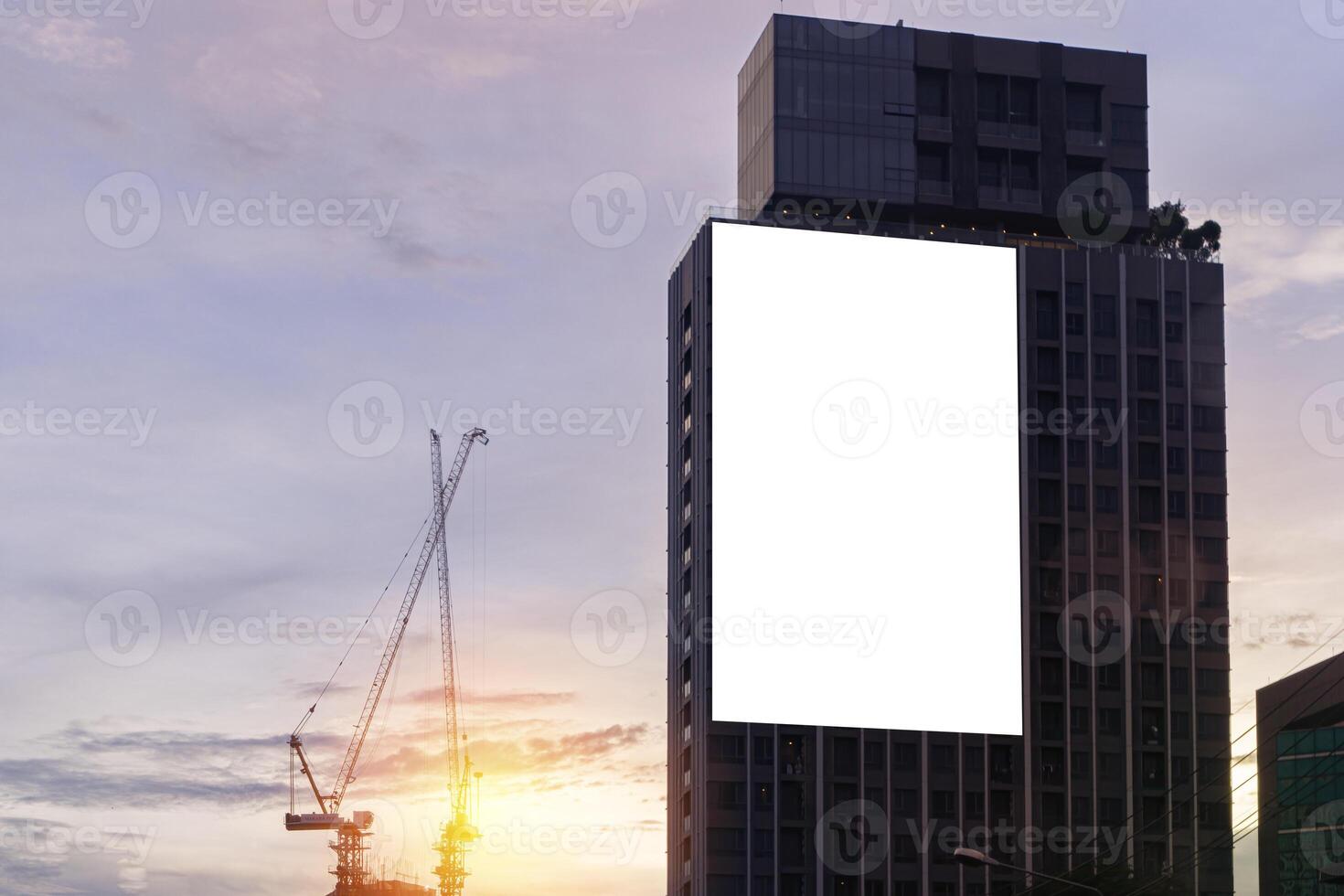 Mock up white background billboard on building, clipping path for Mockup. A large empty billboard on a city background photo