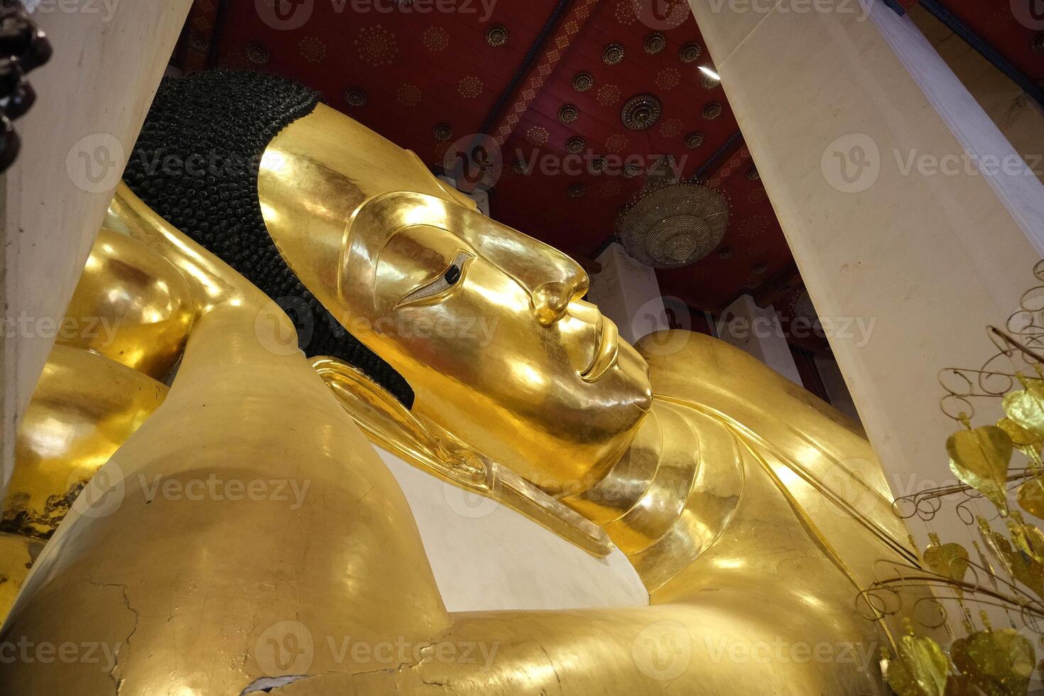 Phra Non Chakkrasi at Wat Phra Non Chakkrasi Worawihan is big gold reclining buddha statue. photo
