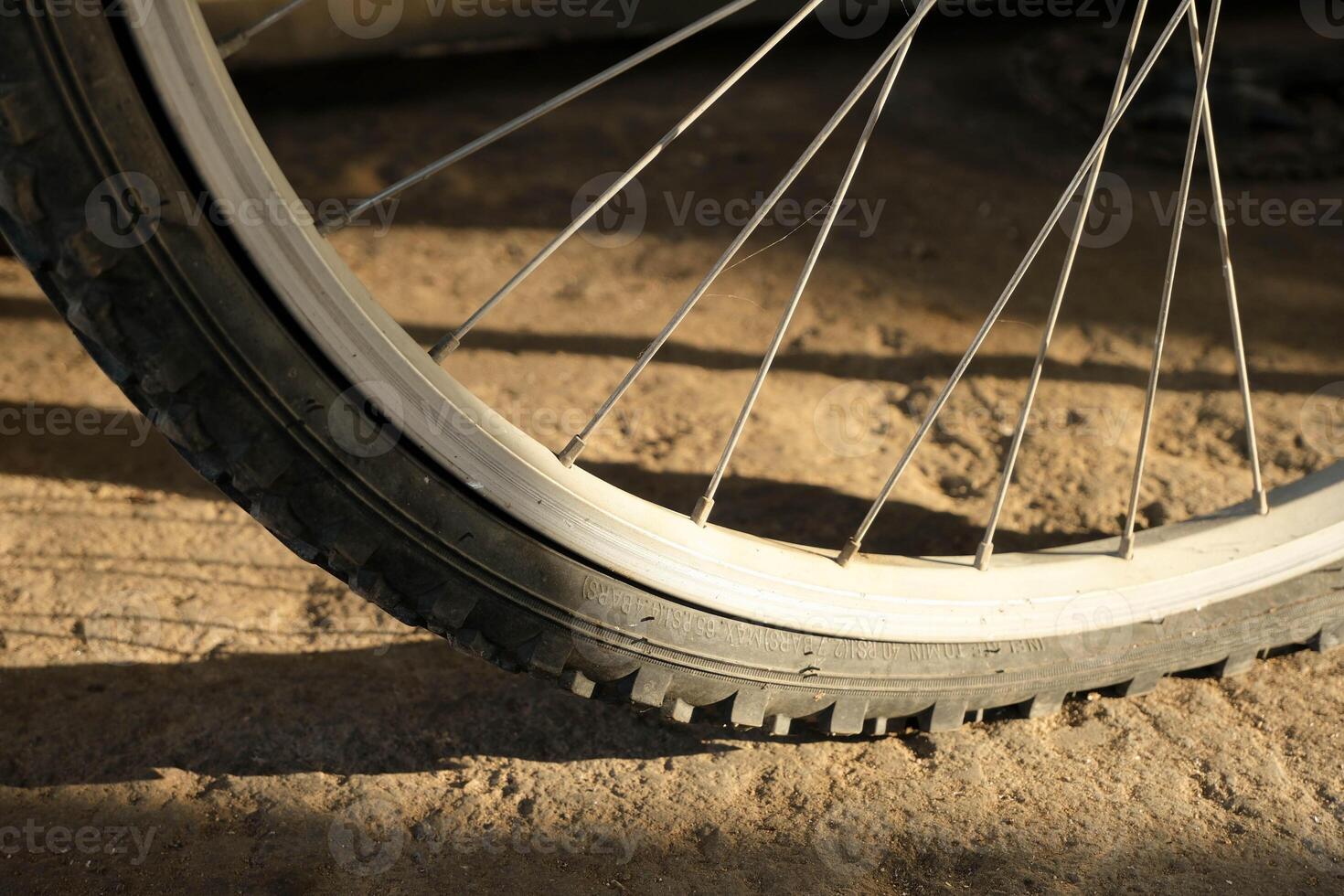 Bicycle wheel on sunset light. photo