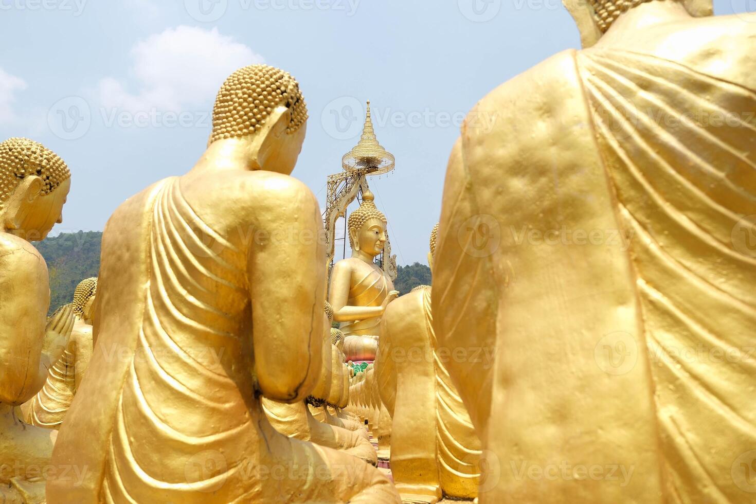 Selected focus of Buddha of Lord buddha among the golden buddha at Buddha Memorial park, Nakhon Nayok, Thailand. photo