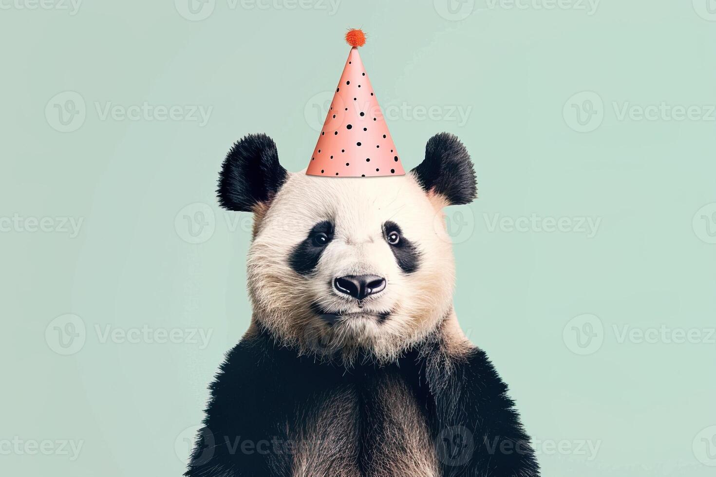 portrait panda in party hat on pale mint background. funny animal birthday celebration concept photo