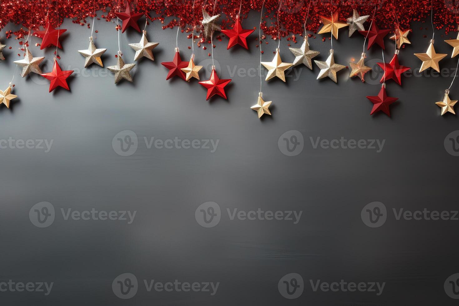 top view composition of Christmas decorations with red and silver stars on grey background. new year holiday banner copy space photo