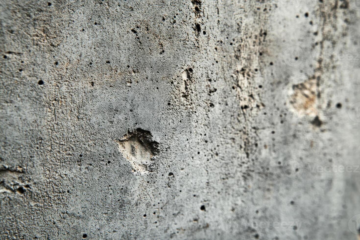 A Close-Up of a Grey, Rough, Pitted Surface photo