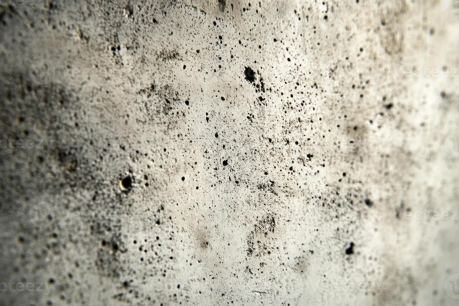 Close-up of a Grey and Black Textured Surface with Circular Indentations photo