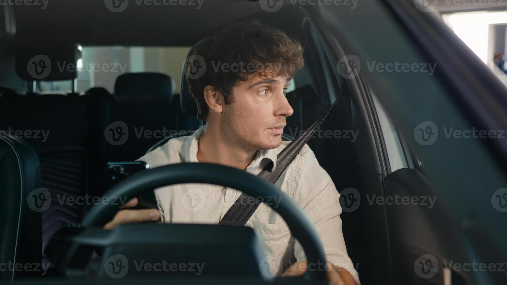 Tired puzzled upset worry anxiety Caucasian man driver male guy sit in car auto businessman frustrated thinking looking at window of automobile holding mobile phone stressed business problem bad news photo