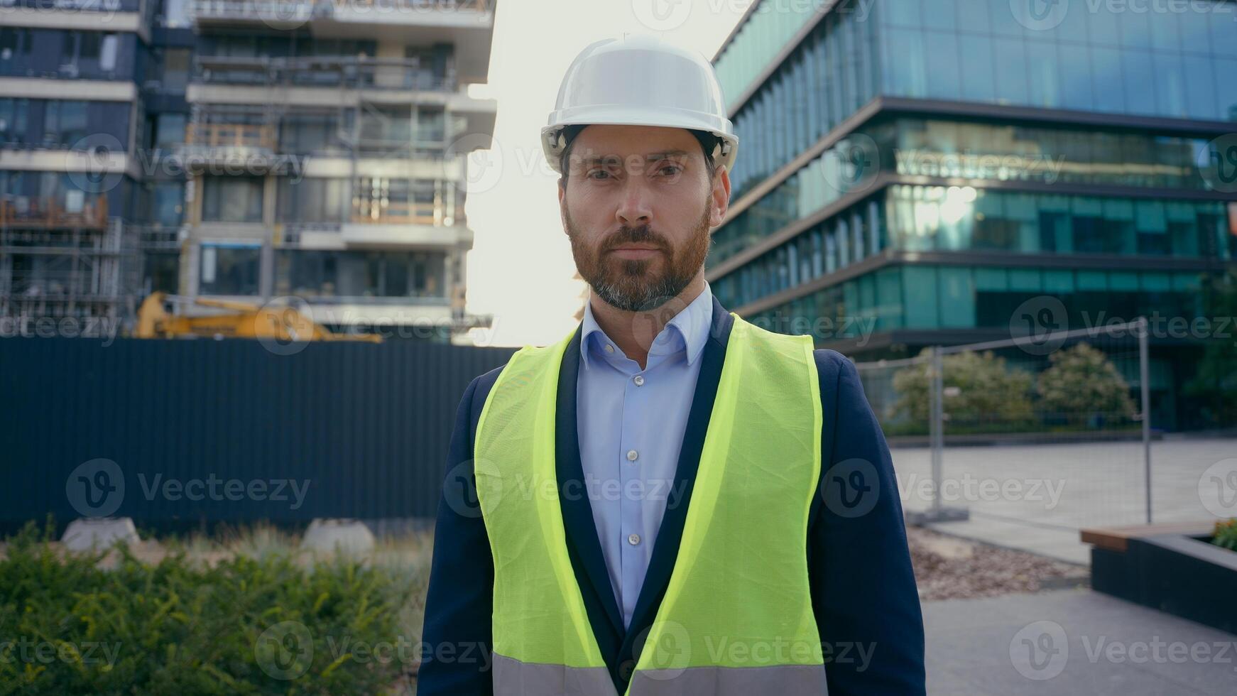 Serious architect build inspector property developer city urban building construction industry Caucasian middle-aged man worker in hardhat male contractor engineer in helmet portrait builder foreman photo