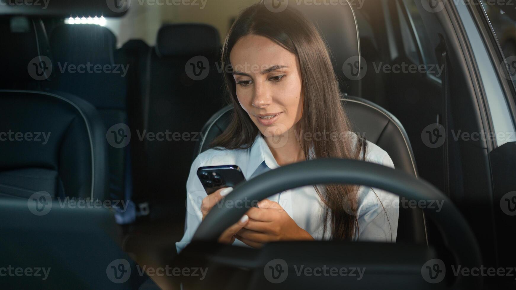 Caucasian businesswoman happy smiling girl business woman successful female driver in car automobile using browsing mobile phone smartphone app in auto smartphone gadget device addict social media photo