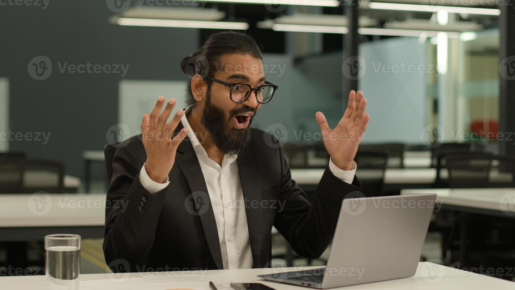 Happy positive Muslim man Indian business male employer Arabian businessman entrepreneur consultant leader manager in office win laptop achieve good result champion success victory offer opportunity photo