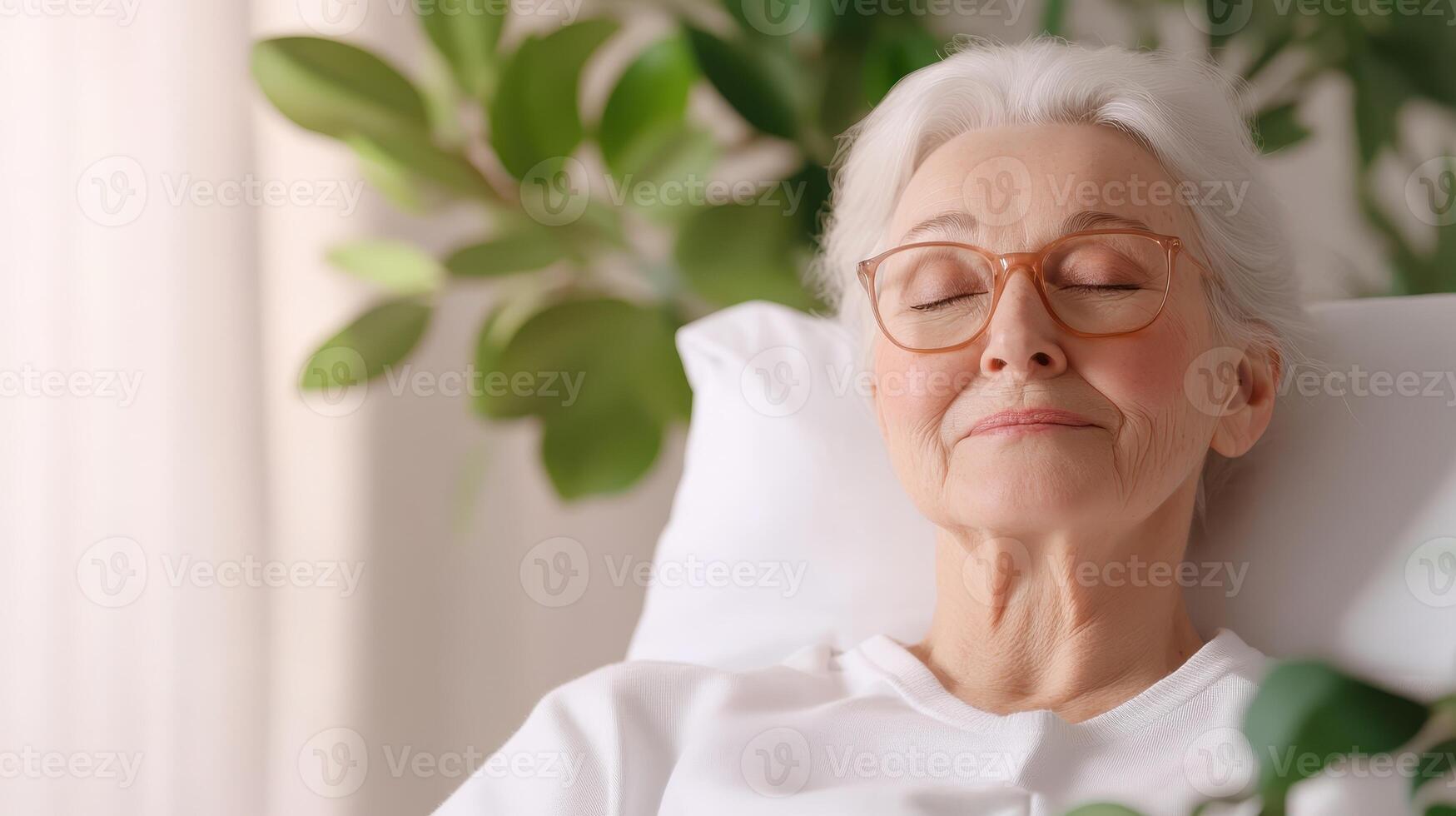 Elderly patient resting peacefully in hospital bed with attentive caregiver by side photo
