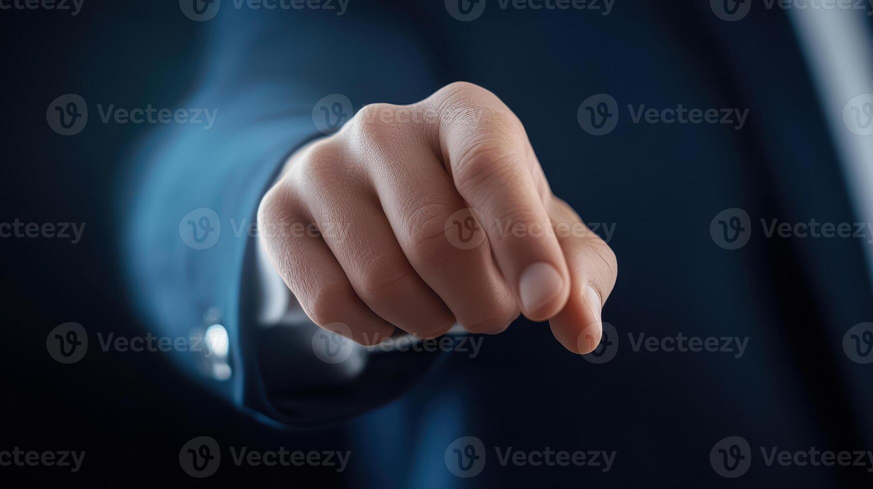 Determined Business Executive Clenching Fist in Office Facing Challenges photo
