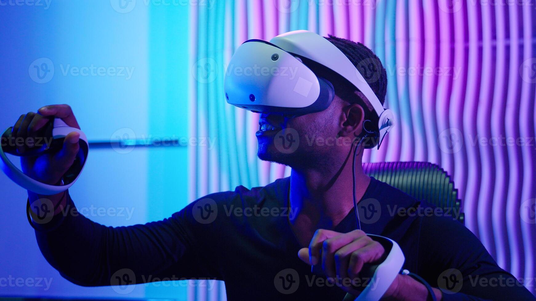 3d gaming African man male guy play controllers VR helmet virtual augmented reality glasses Internet technology futurism cyber game playing innovation metaverse neon futuristic violet blue background photo