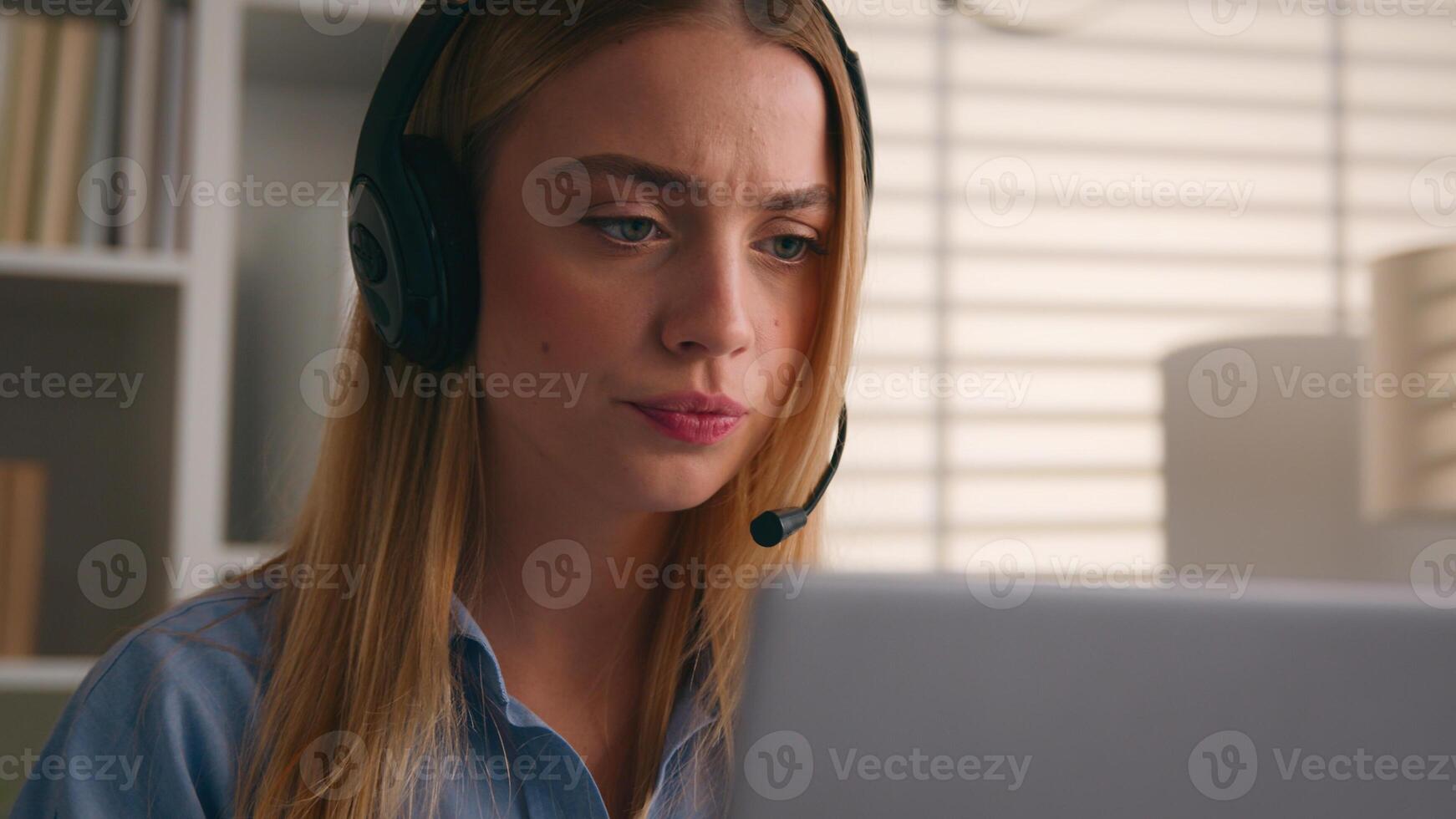 Caucasian woman business girl distant student internet teacher call conference class lesson e-learning virtual meeting nod head yes positive answer listen music headphones with laptop in office photo