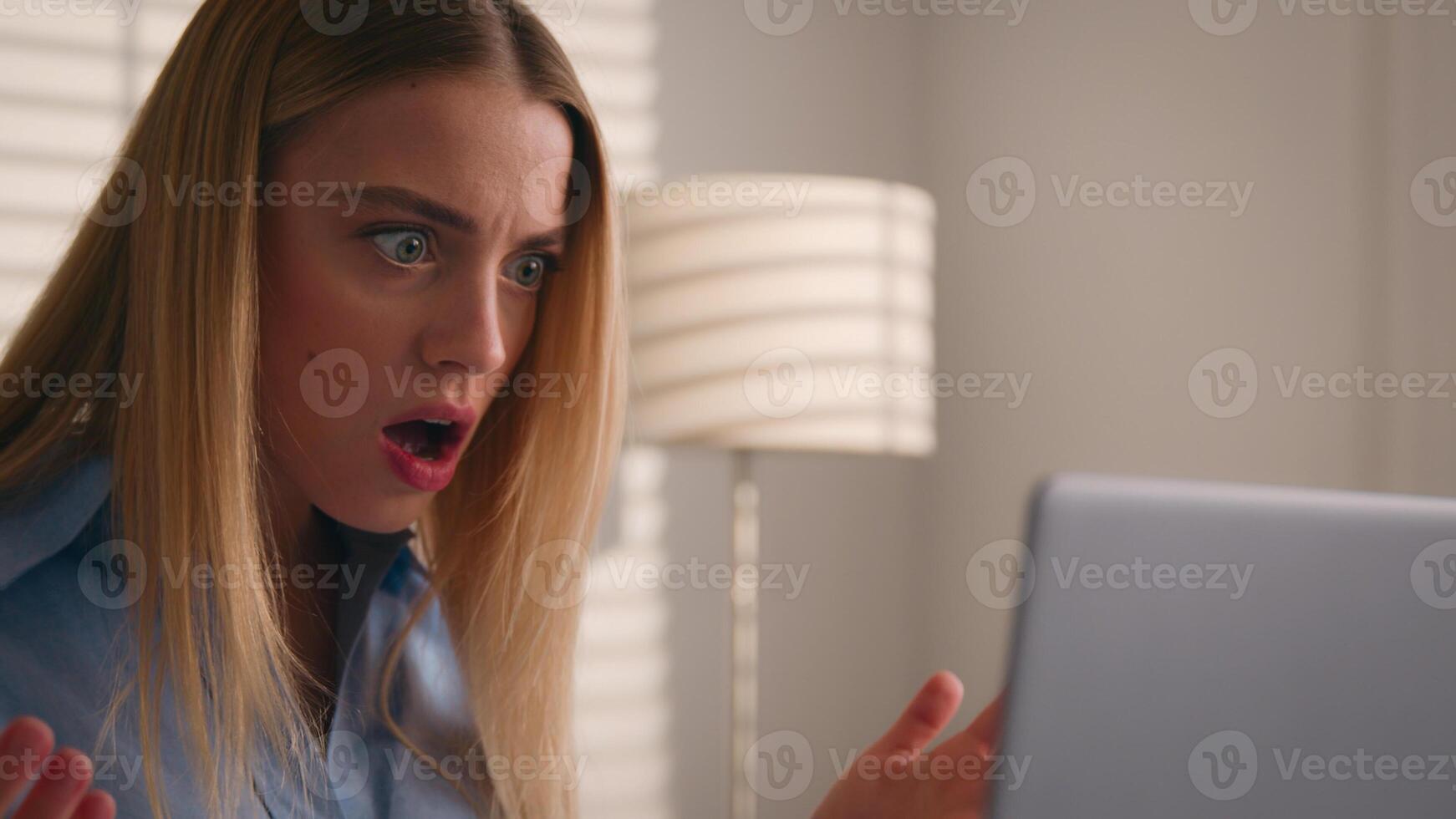 Close up angry upset Caucasian woman user using laptop in home office frustrated mad confused shocked computer problem say what shock failure online stressed girl businesswoman mistake software error photo