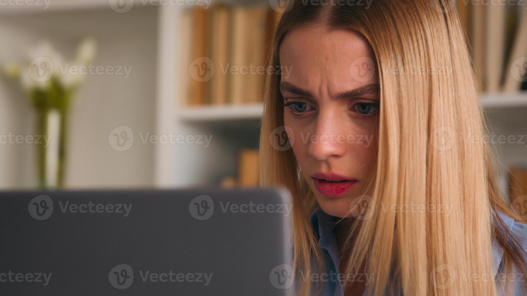 Close up angry upset Caucasian woman user using laptop in home office frustrated mad confused shocked computer problem say what shock failure online stressed girl businesswoman mistake software error photo