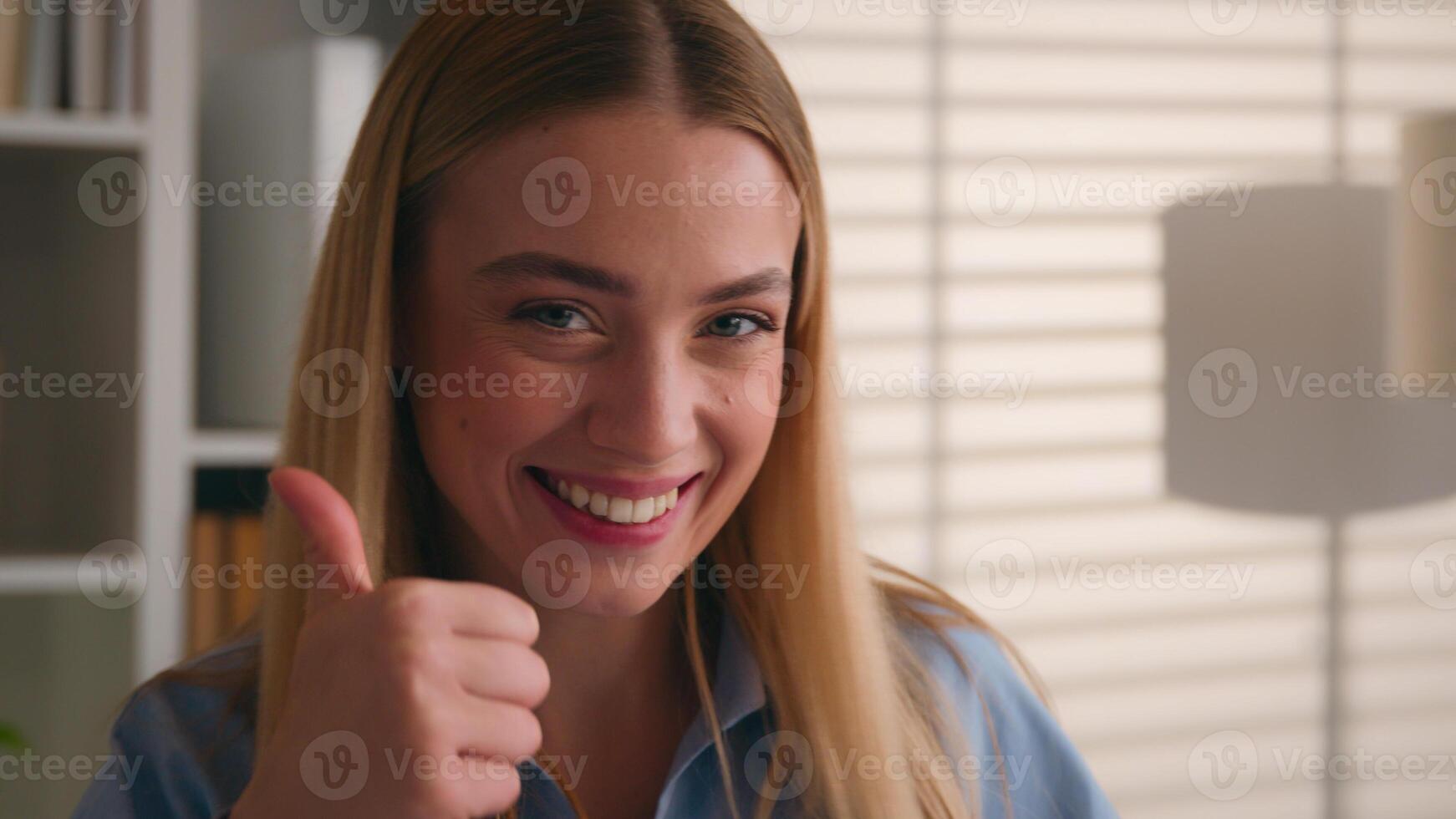 Happy excited carefree Caucasian woman dancing cheerful moving showing thumbs up super thumb gesture student girl celebrate good great perfect result winning dance smiling lady businesswoman achieve photo