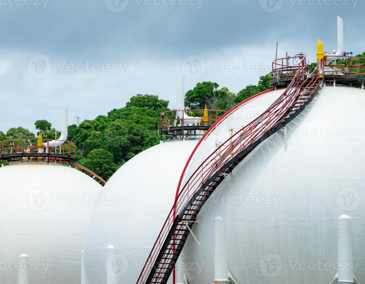 Industrial gas storage tank in factory, LNG or liquefied natural gas container in petroleum refinery. Energy industry infrastructure for natural gas storage. Global energy supply. Fuel reservoir. photo