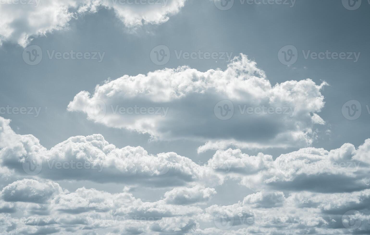 Dramatic overcast sky with gray clouds forming moody and tranquil backdrop before rain, capturing the serene yet stormy atmosphere in the cloudy weather of the rainy season. Moody and peaceful scene. photo