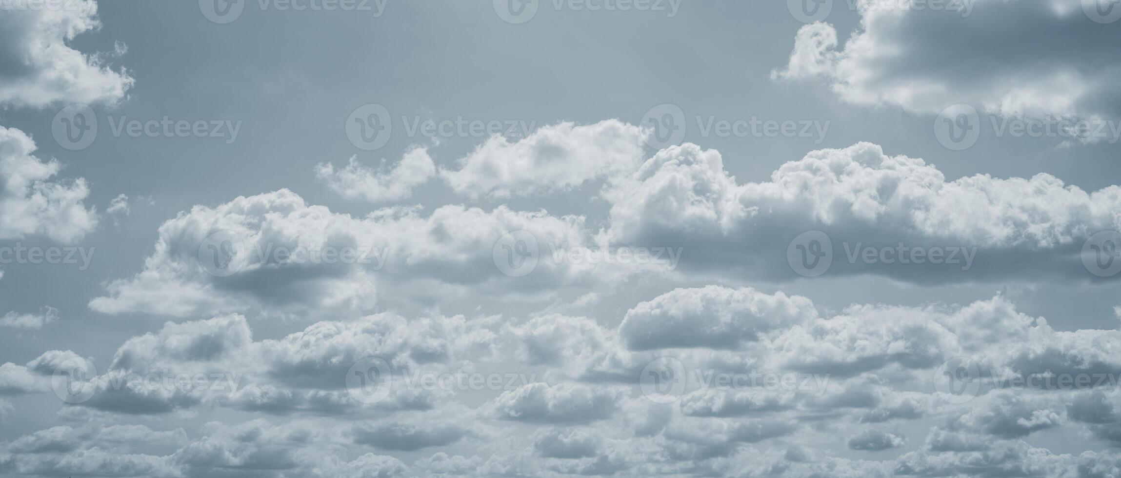 Dramatic overcast sky with gray clouds forming moody and tranquil backdrop before rain, capturing the serene yet stormy atmosphere in the cloudy weather of the rainy season. Moody and peaceful scene. photo