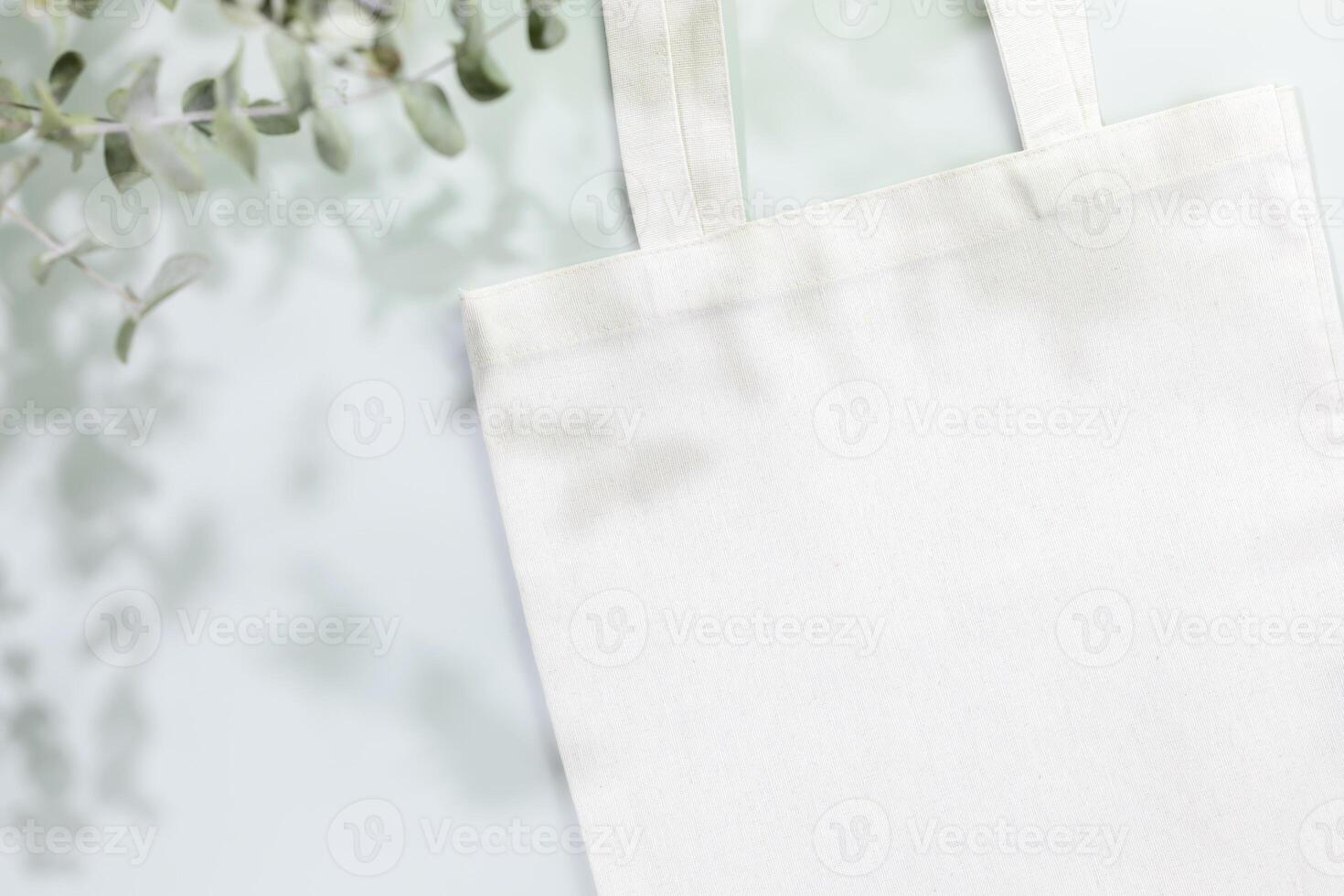 Mockup of white textile shopping bag on light blue background photo