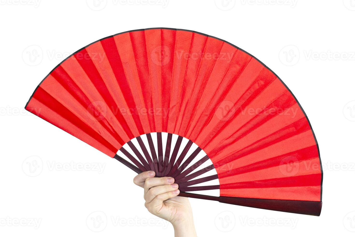 Hand holding a bright red fan for Chinese new year. Hand fan isolated on white background. photo
