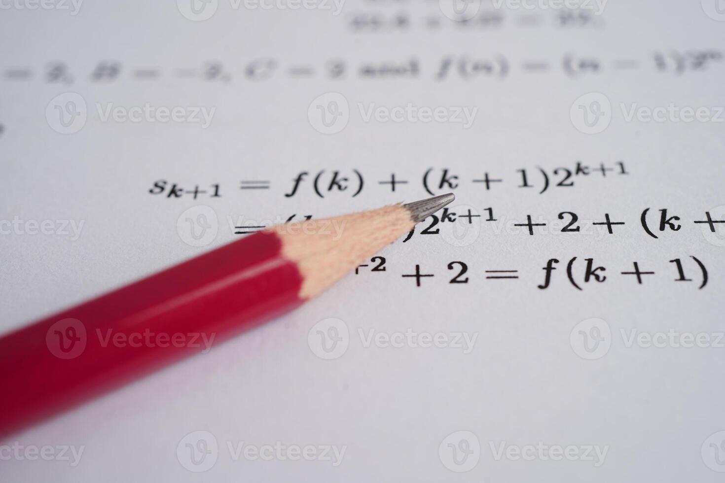 Pencil on mathematic formula exercise test paper in education school. photo