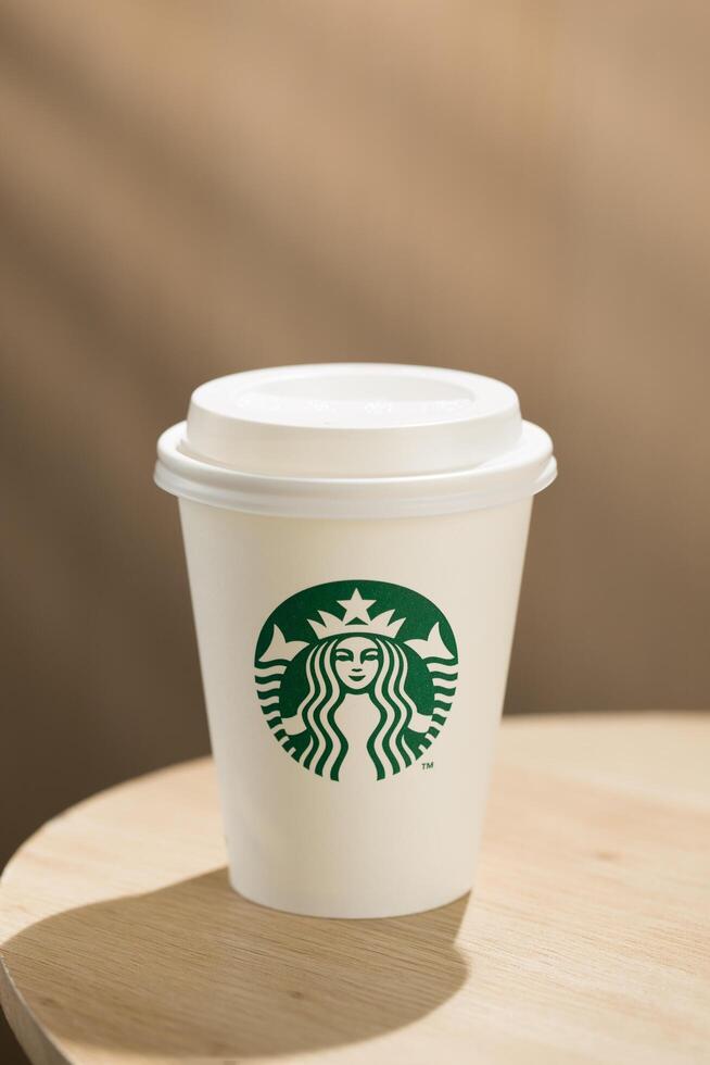 Bang Khae, Bangkok, Thailand, 2024 - Amidst busy lives, Starbucks take away option remains a popular choice for coffee enthusiasts. photo
