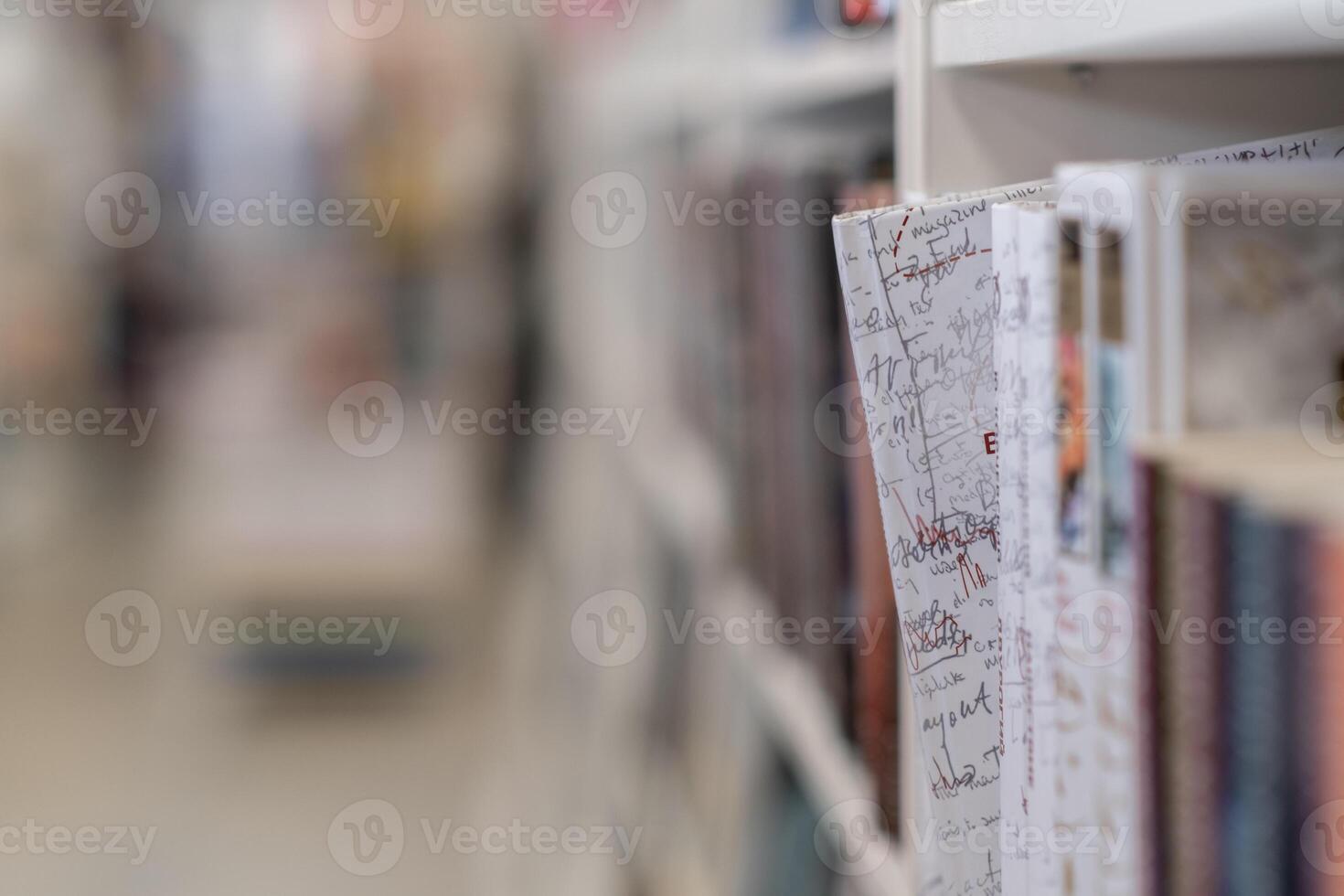 Bookstore with full shelves of various books. photo