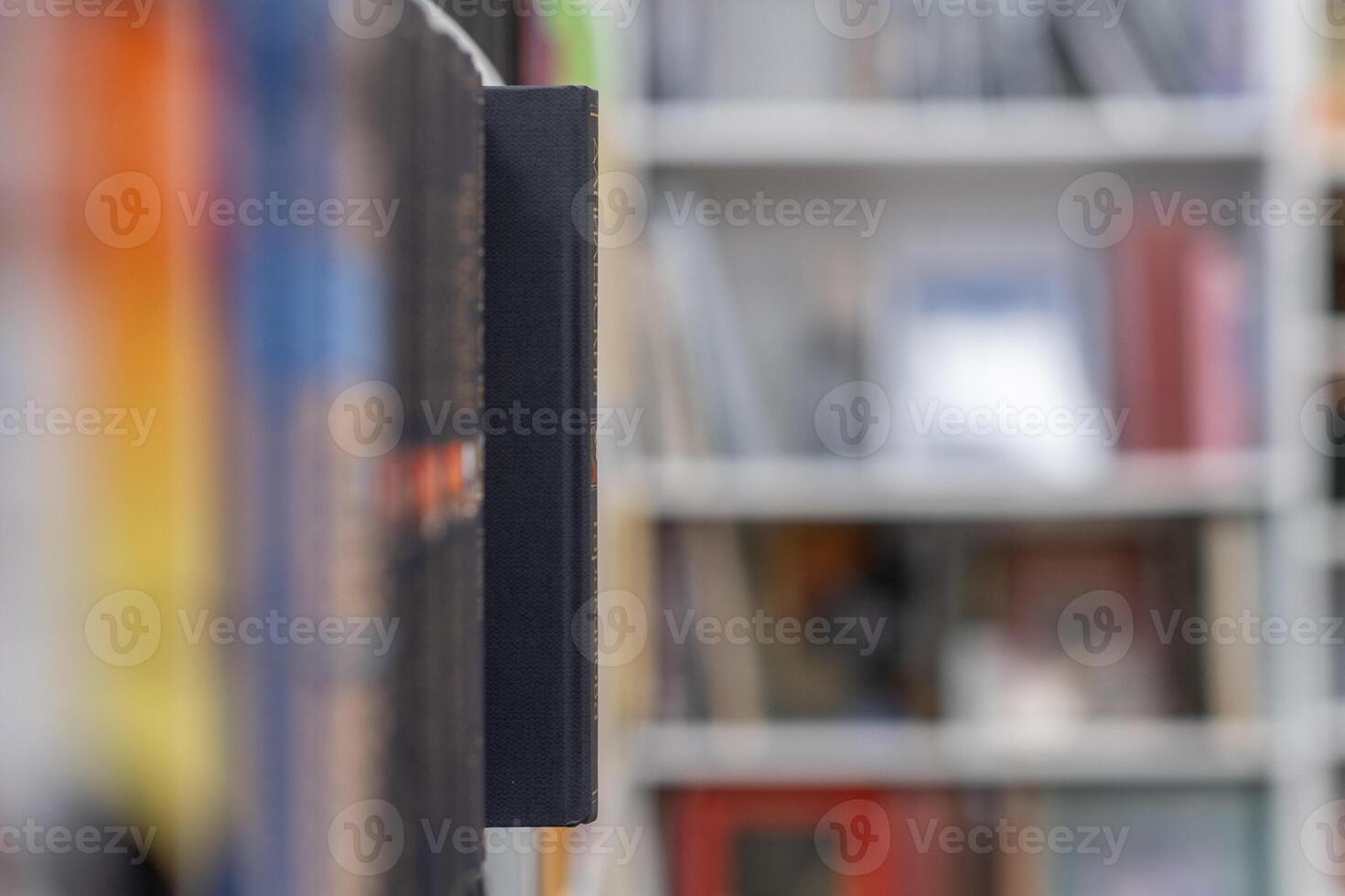 Bookstore with full shelves of various books. photo