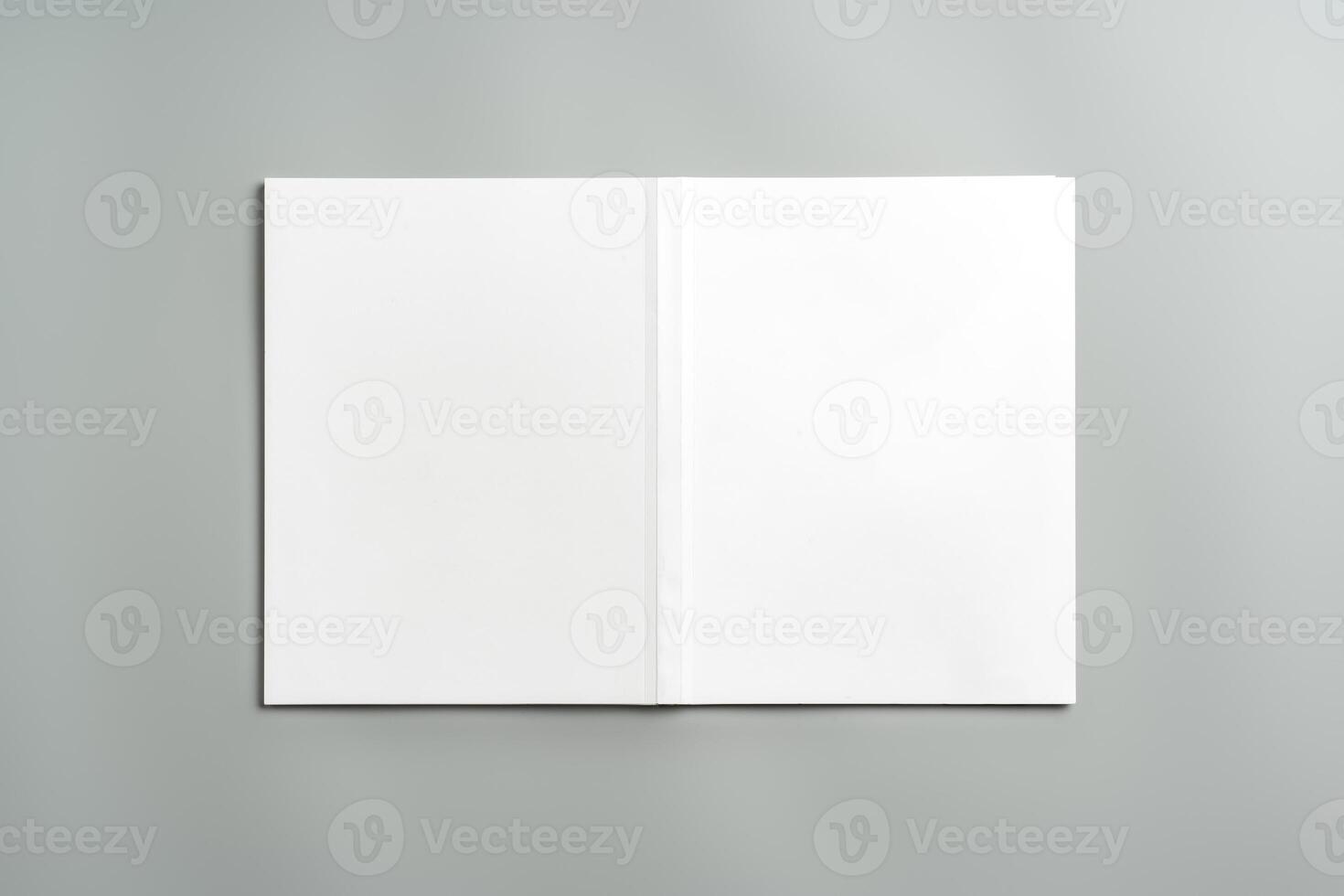 Empty White Sheet of Paper Positioned at an Angle on Light Gray Surface photo
