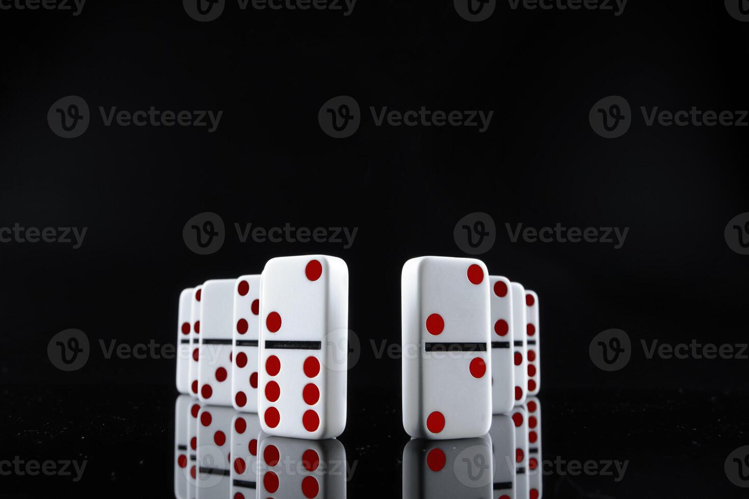 Domino game. Dominoes on a black table photo