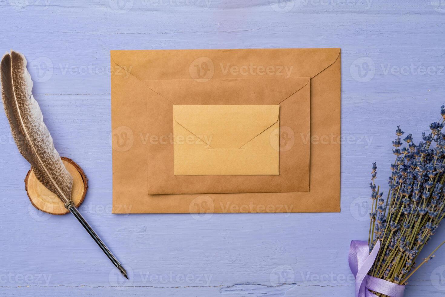 Letter envelope on lavender wooden background, copy space photo