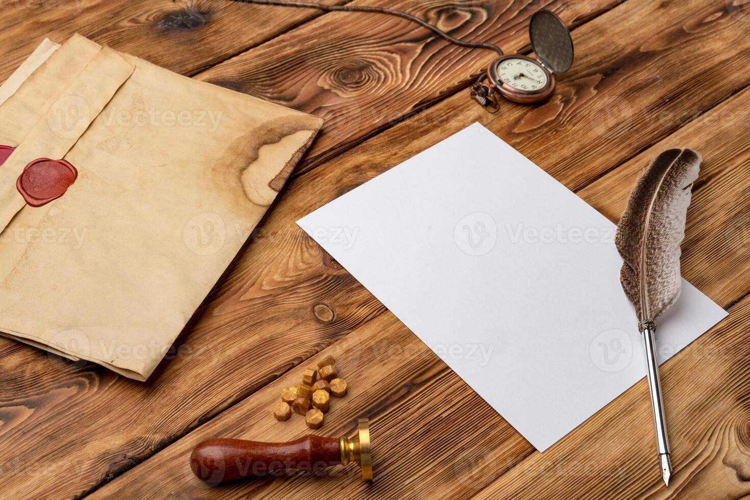 Envelope with wax seal stamp on wooden background, flat lay photo
