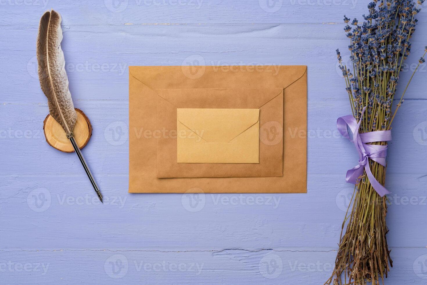 Letter envelope on lavender wooden background, copy space photo